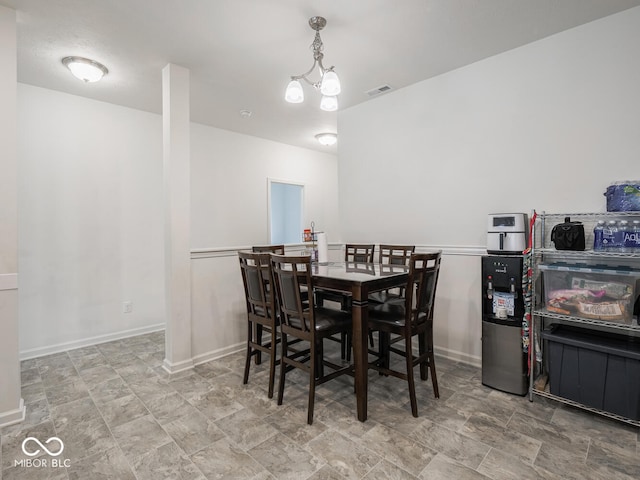 9001 Fitzgerald Dr, Indianapolis, IN 46239 - dining area featuring a chandelier and stone finish floors