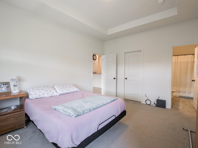 9001 Fitzgerald Dr, Indianapolis, IN 46239 - bedroom featuring carpet, a raised ceiling, ensuite bath, and a closet