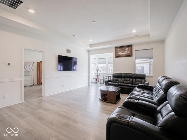 9001 Fitzgerald Dr, Indianapolis, IN 46239 - living area featuring light wood finished floors, a tray ceiling, and recessed lighting