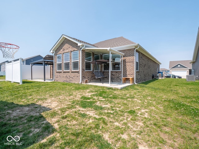 9001 Fitzgerald Dr, Indianapolis, IN 46239 - rear view of property featuring a gazebo, brick siding, and a patio area