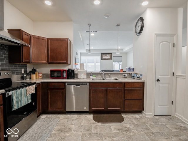 9001 Fitzgerald Dr, Indianapolis, IN 46239 - kitchen with appliances with stainless steel finishes, wall chimney exhaust hood, light countertops, backsplash, and recessed lighting