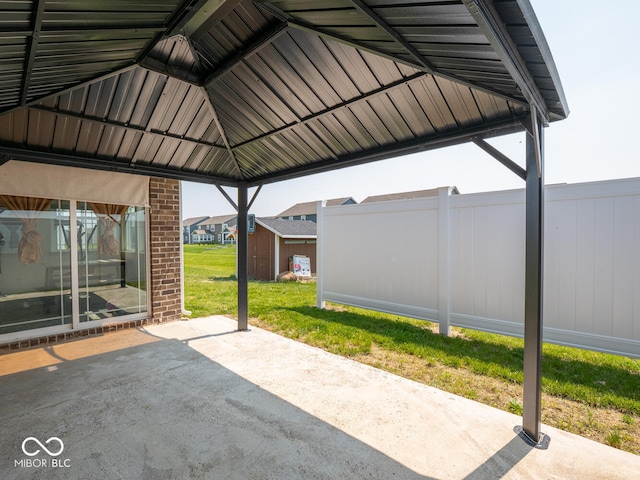 9001 Fitzgerald Dr, Indianapolis, IN 46239 - view of patio / terrace featuring a storage unit