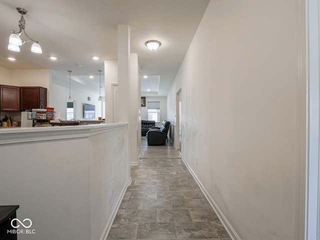 9001 Fitzgerald Dr, Indianapolis, IN 46239 - hallway with baseboards and stone finish floors