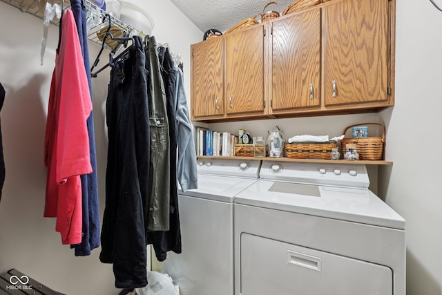 1027 Plum St Unit 39, Brownsburg, IN 46112 - laundry area featuring independent washer and dryer, cabinet space, and a textured ceiling