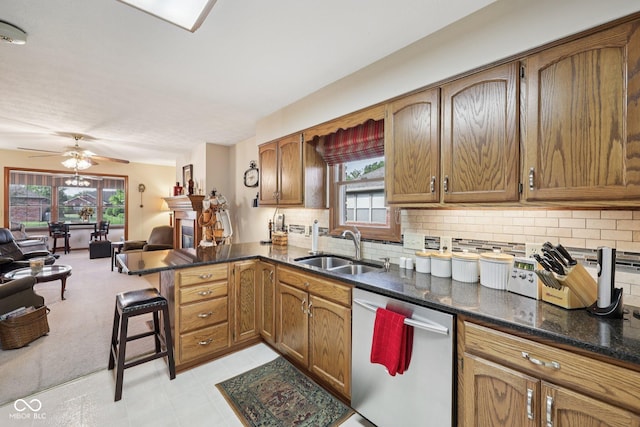 1027 Plum St Unit 39, Brownsburg, IN 46112 - kitchen with stainless steel dishwasher, a peninsula, plenty of natural light, and tasteful backsplash