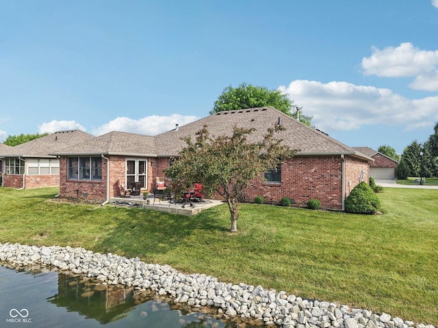 1027 Plum St Unit 39, Brownsburg, IN 46112 - rear view of property with a patio, brick siding, a yard, and roof with shingles