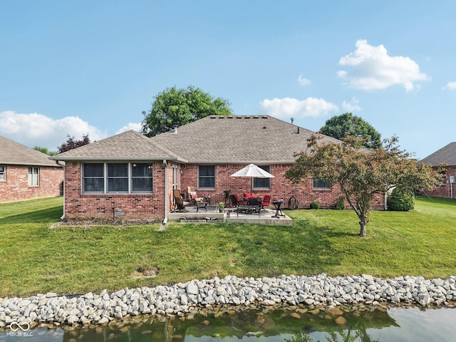 1027 Plum St Unit 39, Brownsburg, IN 46112 - rear view of property with a patio area, roof with shingles, a yard, and brick siding