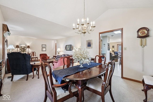 1027 Plum St Unit 39, Brownsburg, IN 46112 - dining area with a chandelier, light carpet, and vaulted ceiling