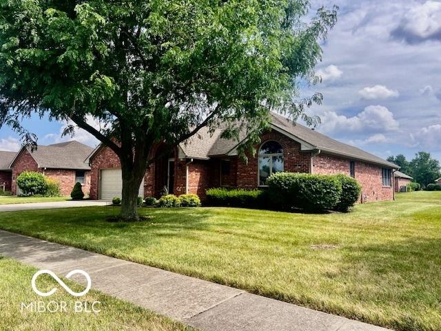 1027 Plum St Unit 39, Brownsburg, IN 46112 - single story home with brick siding, a front yard, an attached garage, and driveway