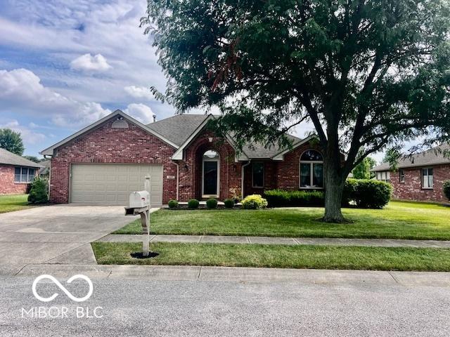 1027 Plum St Unit 39, Brownsburg, IN 46112 - ranch-style home with a garage, concrete driveway, a front lawn, and brick siding