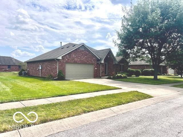 1027 Plum St Unit 39, Brownsburg, IN 46112 - ranch-style house with an attached garage, a front lawn, driveway, and brick siding