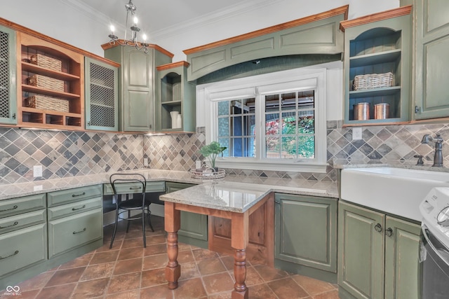 10471 Winghaven Dr, Noblesville, IN 46060 - kitchen with open shelves, green cabinets, ornamental molding, and decorative backsplash