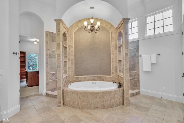 10471 Winghaven Dr, Noblesville, IN 46060 - bathroom featuring a chandelier, a garden tub, and tiled shower