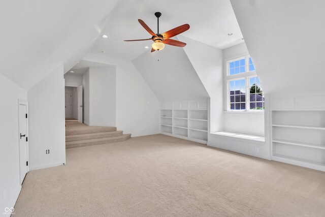 10471 Winghaven Dr, Noblesville, IN 46060 - additional living space with built in shelves, carpet floors, lofted ceiling, a ceiling fan, and recessed lighting