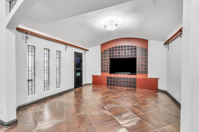 10471 Winghaven Dr, Noblesville, IN 46060 - unfurnished living room with lofted ceiling and tile patterned flooring