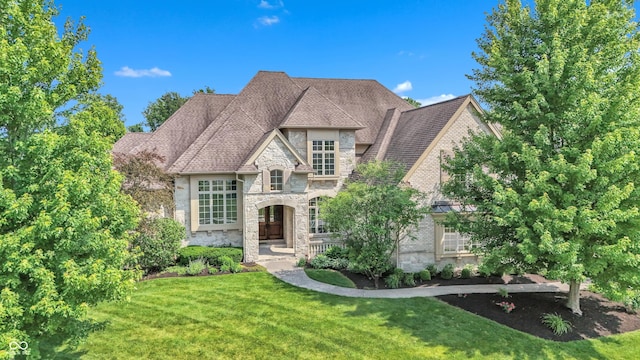 10471 Winghaven Dr, Noblesville, IN 46060 - french country home featuring stone siding and a front yard