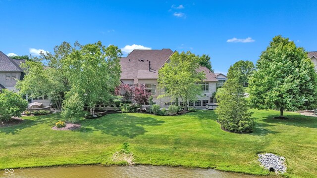 10471 Winghaven Dr, Noblesville, IN 46060 - back of house featuring a lawn and a water view