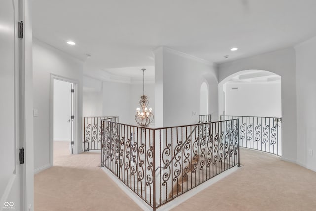 10471 Winghaven Dr, Noblesville, IN 46060 - hall with carpet, a chandelier, crown molding, recessed lighting, and an upstairs landing