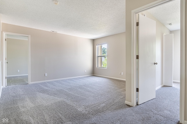 3351 Summer Breeze Cir, Indianapolis, IN 46239 - unfurnished room featuring a textured ceiling, carpet, and a smoke detector