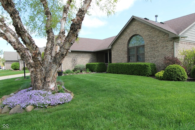 421 Kingsway Ct, Mooresville, IN 46158 - ranch-style house with brick siding, a front yard, and a shingled roof