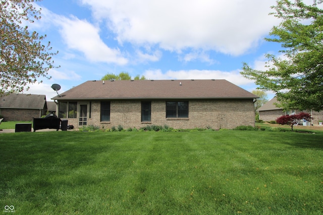 421 Kingsway Ct, Mooresville, IN 46158 - rear view of house with a lawn and brick siding