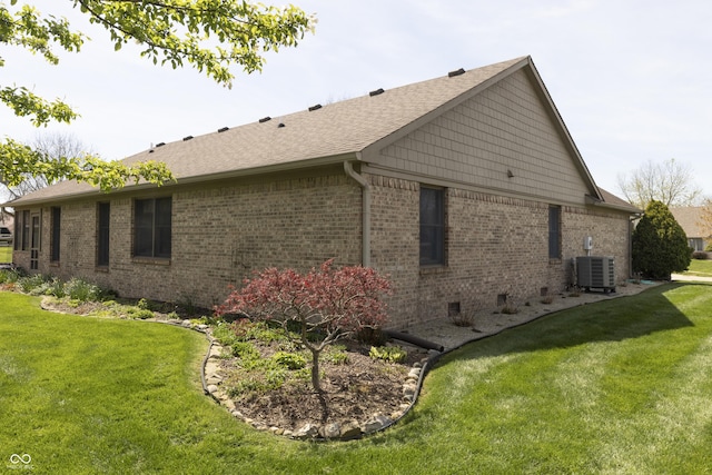 421 Kingsway Ct, Mooresville, IN 46158 - view of side of home with cooling unit, brick siding, a yard, and a shingled roof