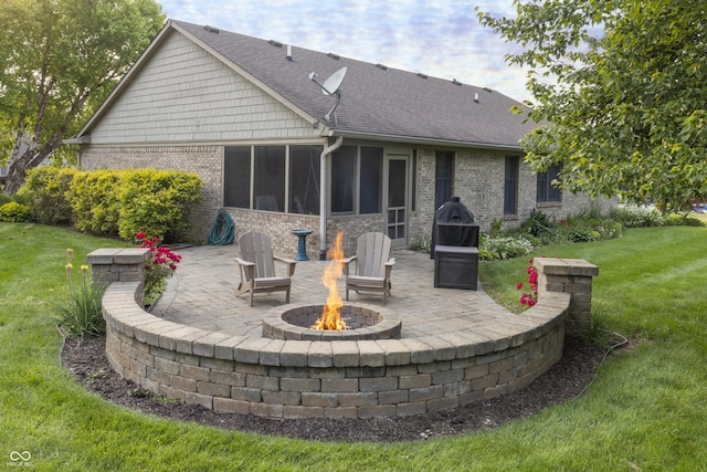 421 Kingsway Ct, Mooresville, IN 46158 - rear view of property with a patio, a fire pit, a yard, and a sunroom