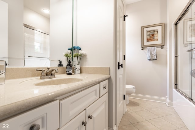 13346 W Sherbern Dr, Carmel, IN 46032 - full bath with vanity, tile patterned flooring, enclosed tub / shower combo, and recessed lighting