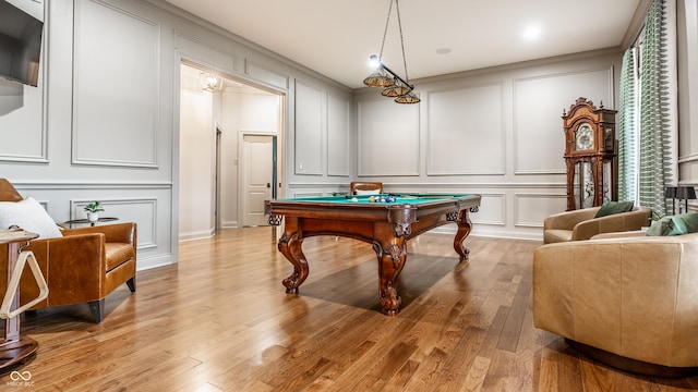13346 W Sherbern Dr, Carmel, IN 46032 - playroom with a decorative wall, pool table, and light wood-type flooring
