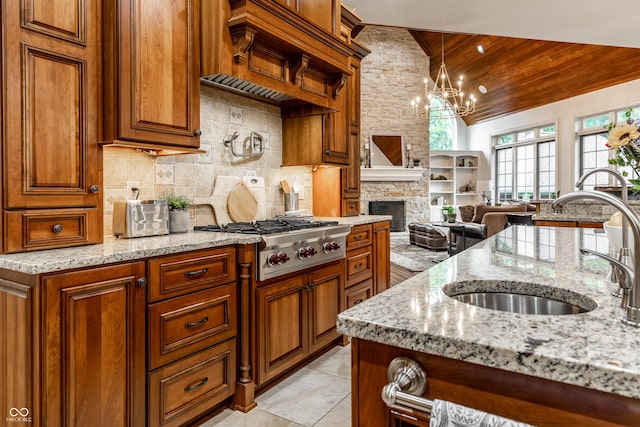 13346 W Sherbern Dr, Carmel, IN 46032 - kitchen featuring wooden ceiling, stainless steel gas stovetop, light stone countertops, backsplash, and brown cabinetry