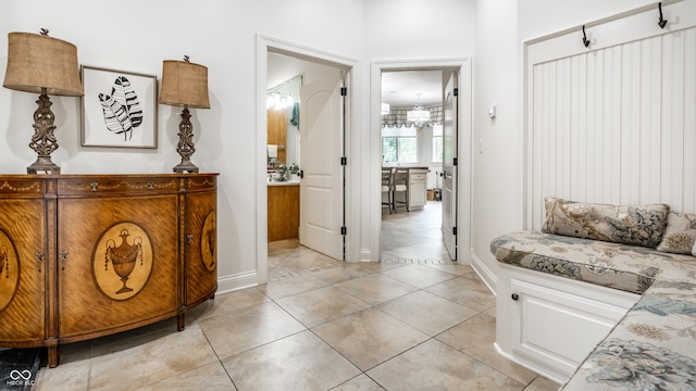 13346 W Sherbern Dr, Carmel, IN 46032 - hall featuring light tile patterned floors and baseboards