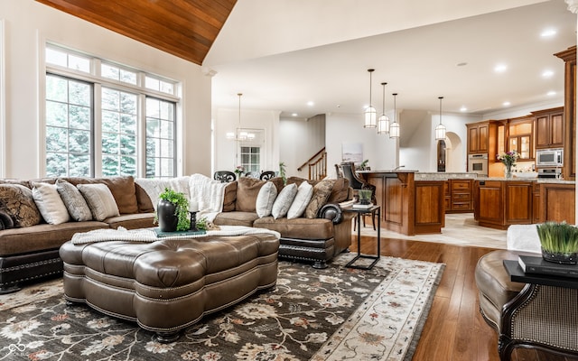 13346 W Sherbern Dr, Carmel, IN 46032 - living area with light wood-type flooring, wooden ceiling, recessed lighting, vaulted ceiling, and stairway