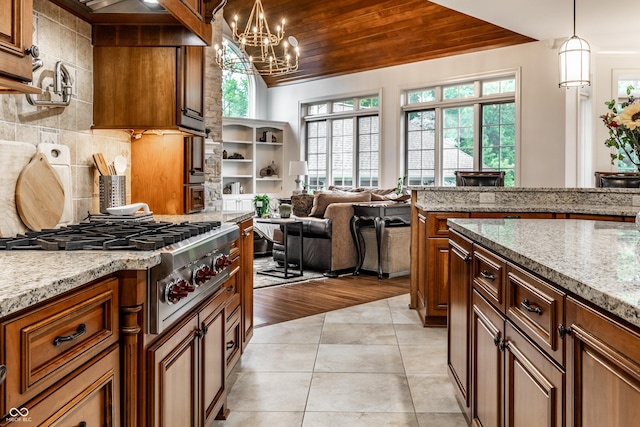 13346 W Sherbern Dr, Carmel, IN 46032 - kitchen featuring stainless steel gas cooktop, plenty of natural light, wood ceiling, vaulted ceiling, and light stone countertops