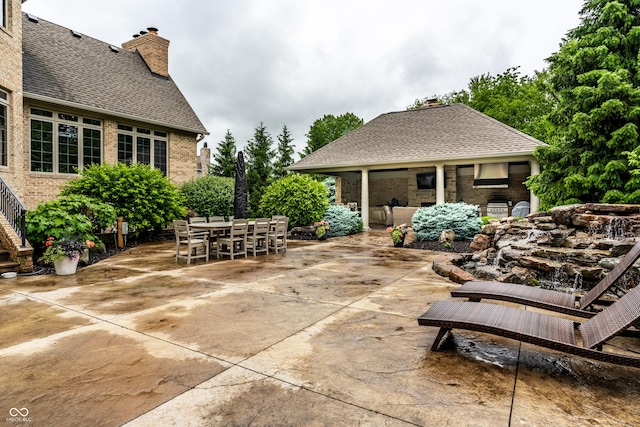 13346 W Sherbern Dr, Carmel, IN 46032 - view of patio featuring stairway and outdoor dining space
