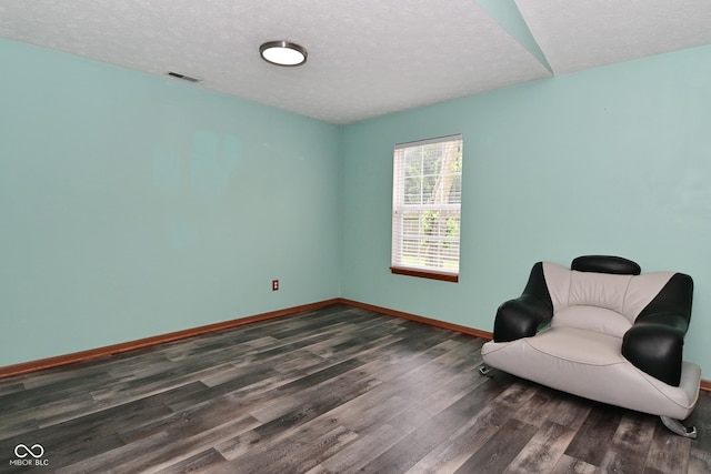 1411 Mimosa Ct, Greenfield, IN 46140 - living area featuring dark wood-type flooring and a textured ceiling