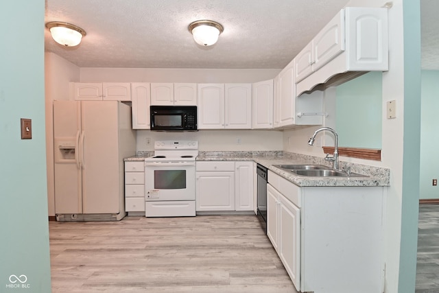 1411 Mimosa Ct, Greenfield, IN 46140 - kitchen featuring white appliances, white cabinets, light wood-type flooring, and a textured ceiling