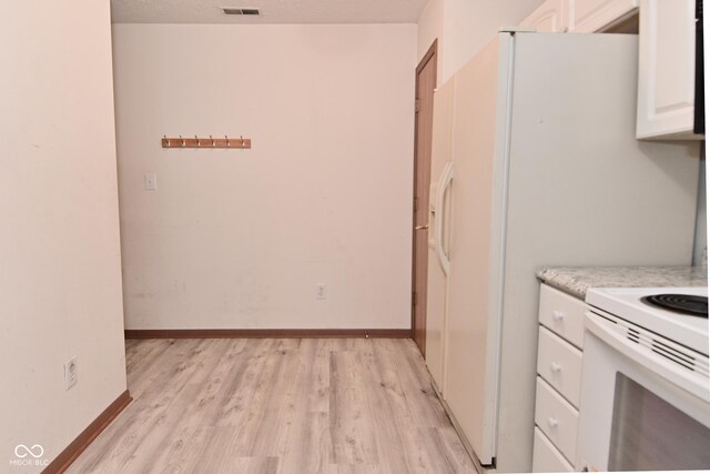 1411 Mimosa Ct, Greenfield, IN 46140 - kitchen featuring white electric range, white cabinetry, and light wood-type flooring