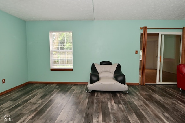 1411 Mimosa Ct, Greenfield, IN 46140 - living area with wood finished floors and a textured ceiling