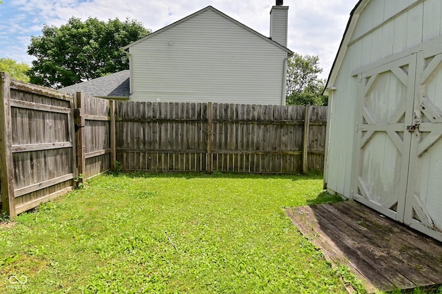 1411 Mimosa Ct, Greenfield, IN 46140 - fenced backyard with a storage unit
