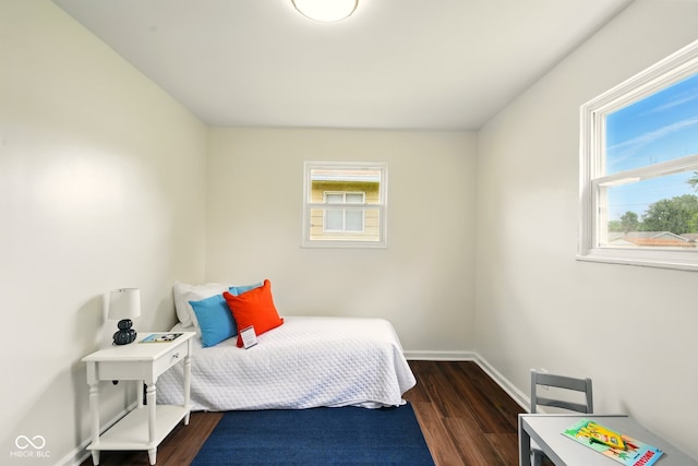 1513 S Rural St, Indianapolis, IN 46203 - bedroom with multiple windows, wood finished floors, and baseboards