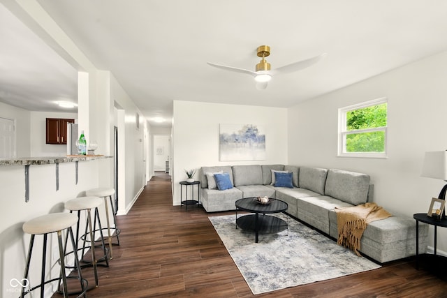 1513 S Rural St, Indianapolis, IN 46203 - living area featuring dark wood-style flooring, a ceiling fan, and baseboards