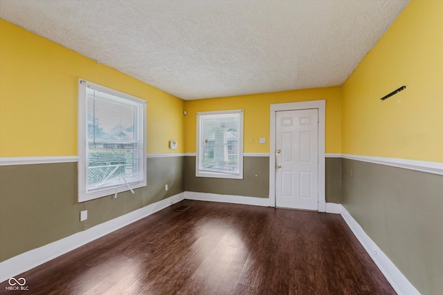 1938 N Dearborn St, Indianapolis, IN 46218 - spare room with plenty of natural light, a textured ceiling, and wood finished floors