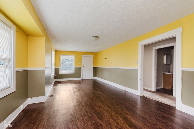 1938 N Dearborn St, Indianapolis, IN 46218 - unfurnished room with a textured ceiling and wood finished floors