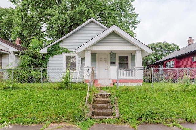 1938 N Dearborn St, Indianapolis, IN 46218 - bungalow-style home featuring a porch