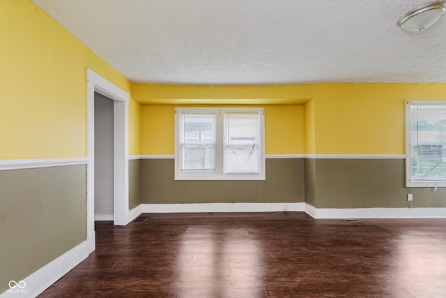 1938 N Dearborn St, Indianapolis, IN 46218 - empty room with a textured ceiling and wood finished floors