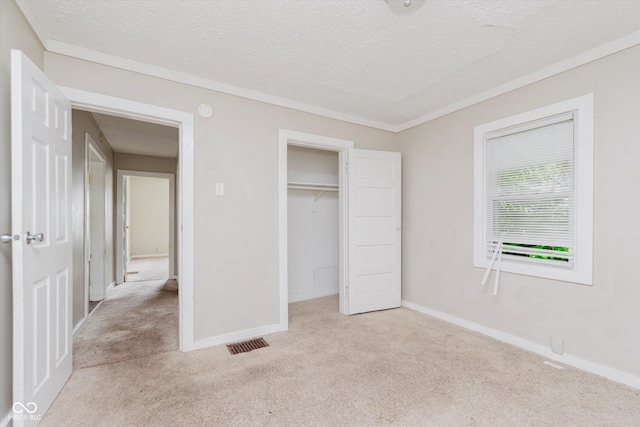 1938 N Dearborn St, Indianapolis, IN 46218 - unfurnished bedroom with light colored carpet, a textured ceiling, and a closet