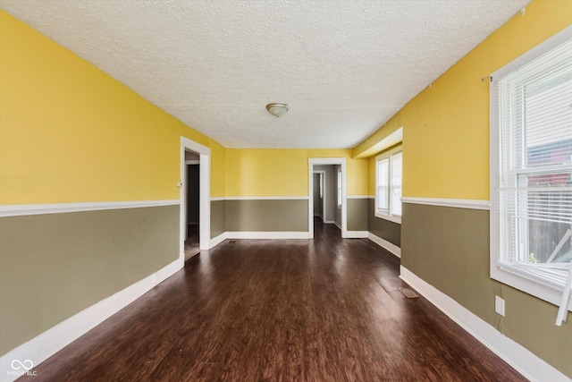 1938 N Dearborn St, Indianapolis, IN 46218 - unfurnished room featuring wood finished floors and a textured ceiling