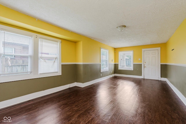 1938 N Dearborn St, Indianapolis, IN 46218 - unfurnished room with a textured ceiling and wood finished floors