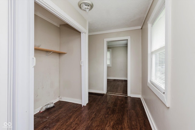1938 N Dearborn St, Indianapolis, IN 46218 - unfurnished bedroom featuring wood finished floors, a closet, multiple windows, and ornamental molding