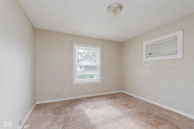 1938 N Dearborn St, Indianapolis, IN 46218 - spare room featuring carpet and a textured ceiling
